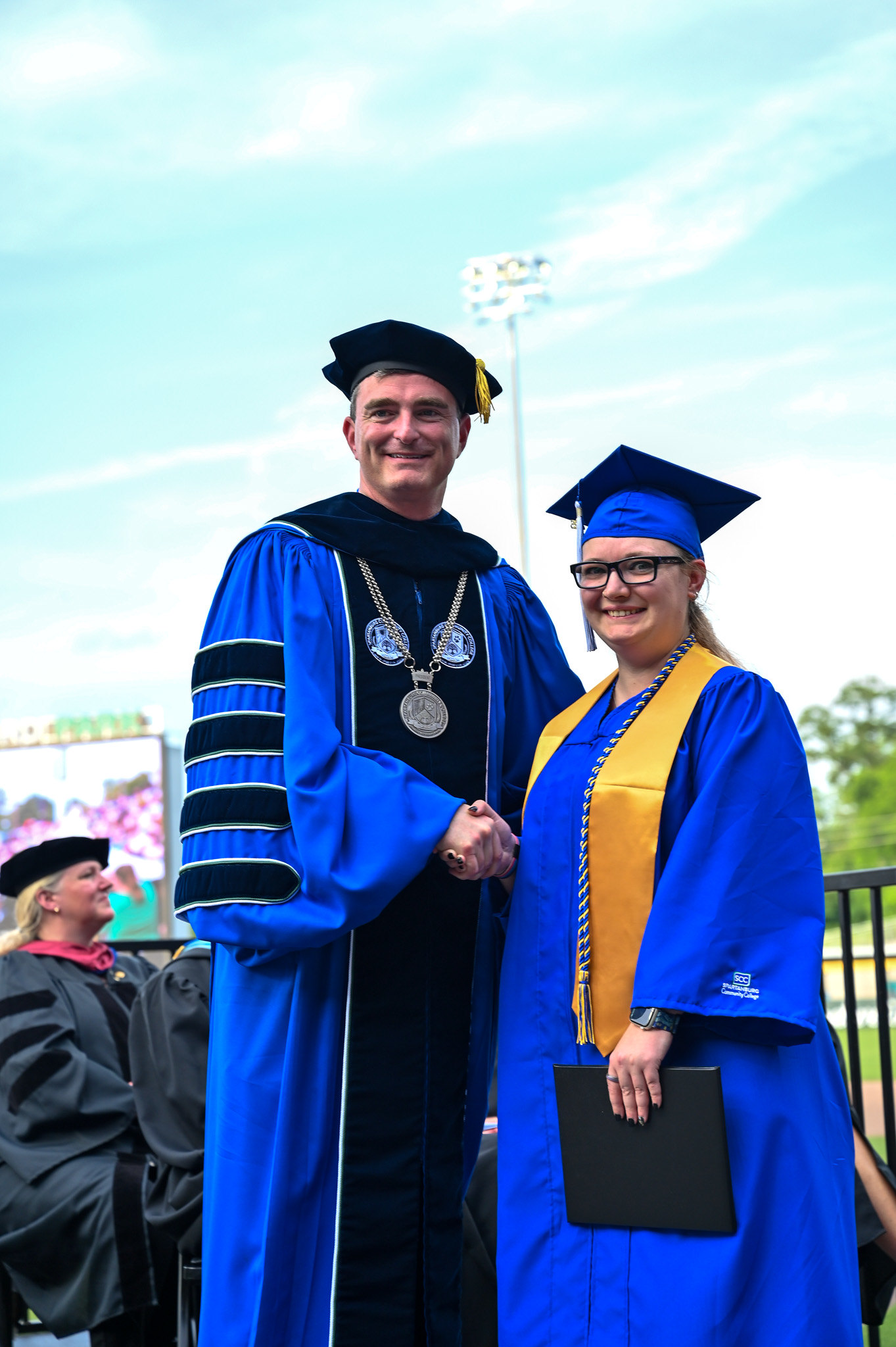 Image of SCC's Dr. Mikota with graduating student