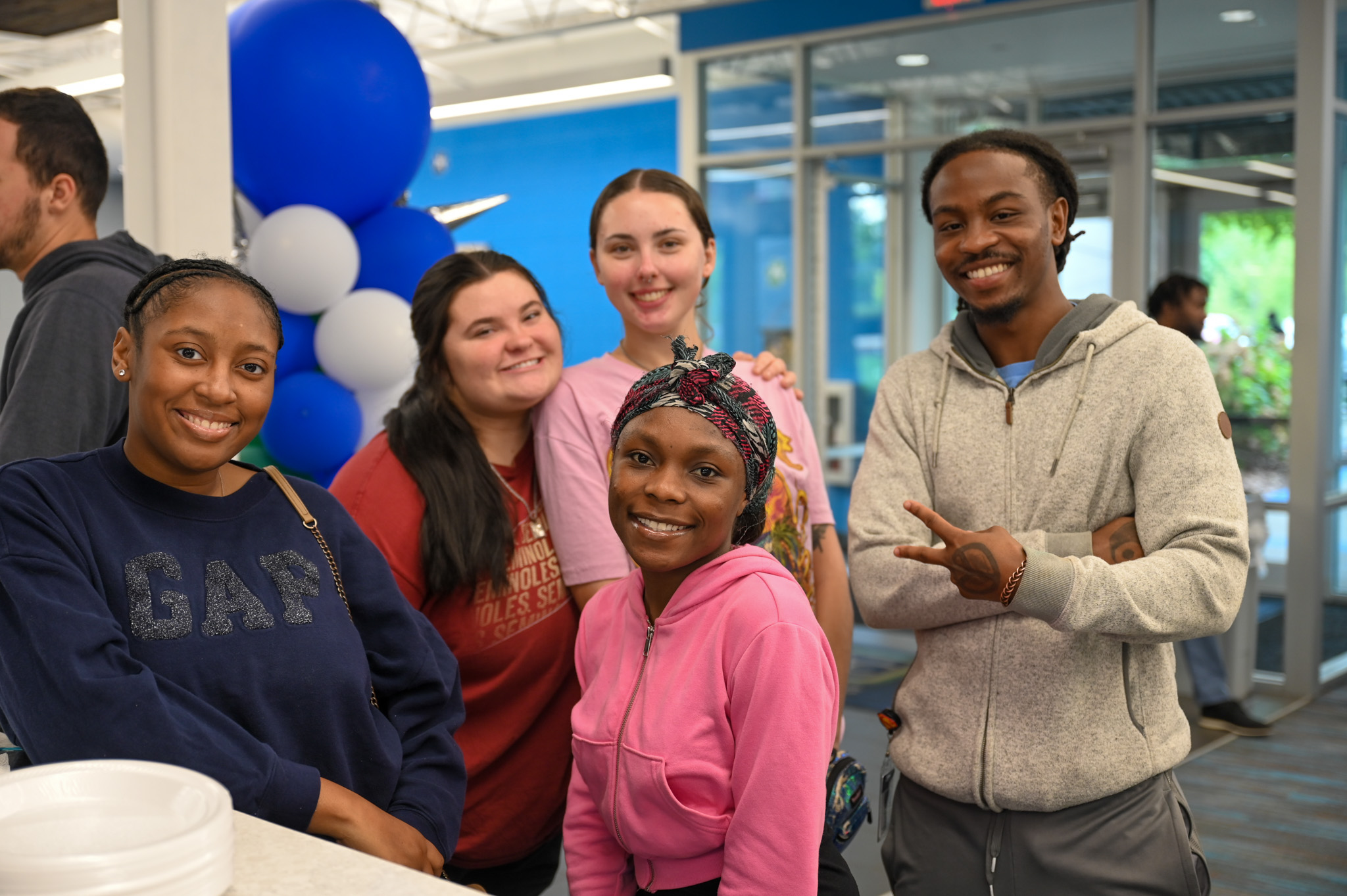 a group of students pose with each other at a celebration