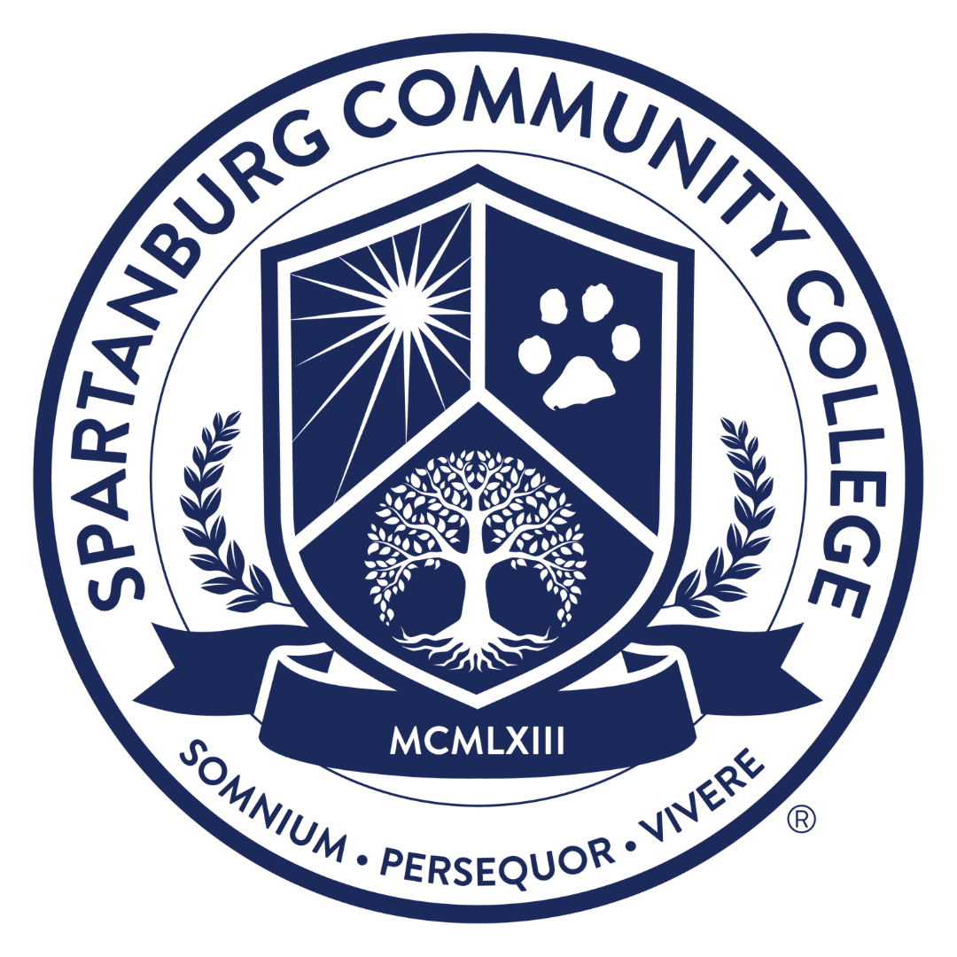 The official circular seal of Spartanburg Community College is a monochromatic dark blue and white design. A wide outer ring contains the institution's name at the top and the Latin motto 